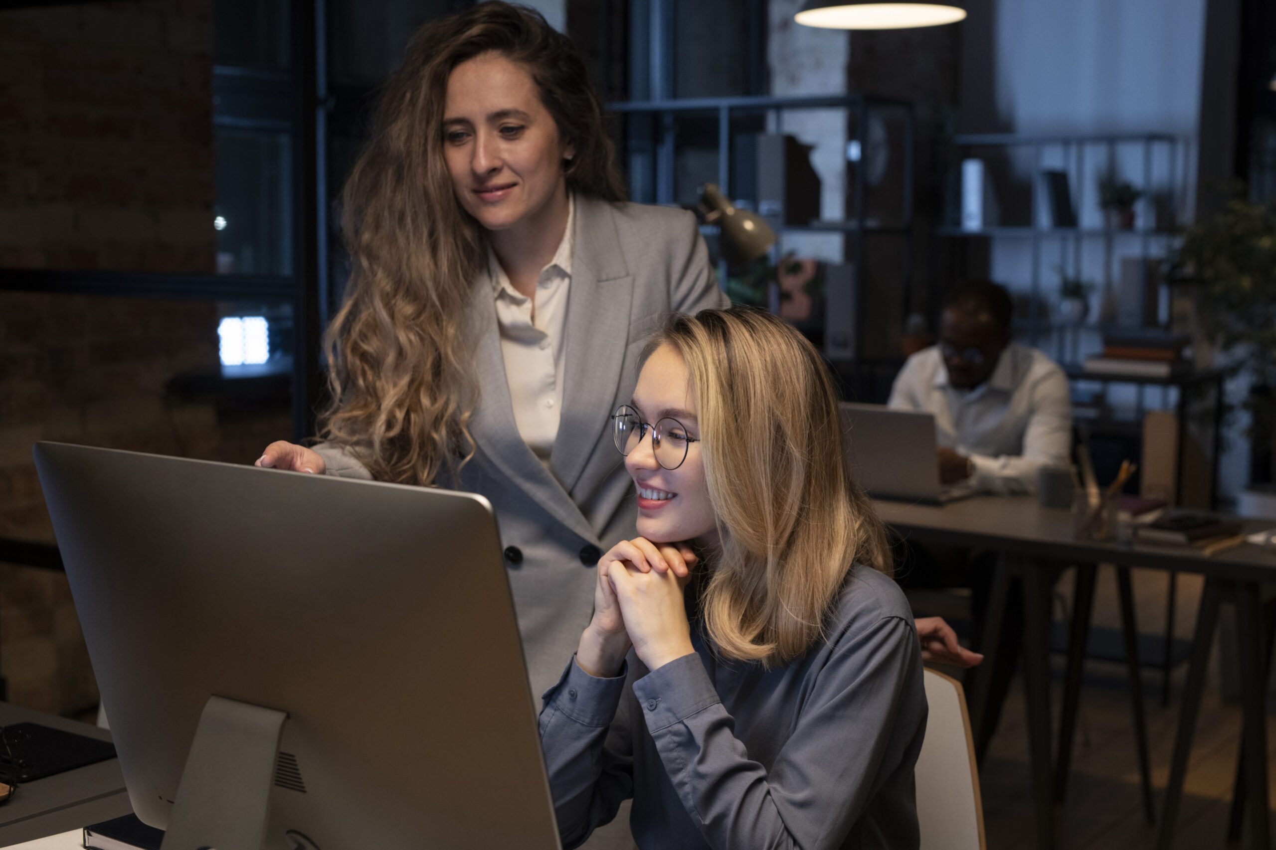coworkers-looking-monitor.jpg